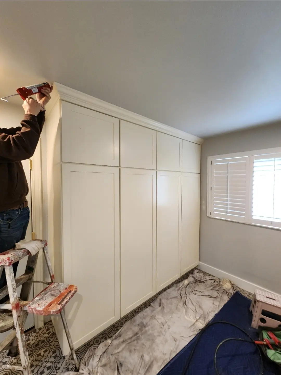 Finishing trim on full-height built-in cabinetry