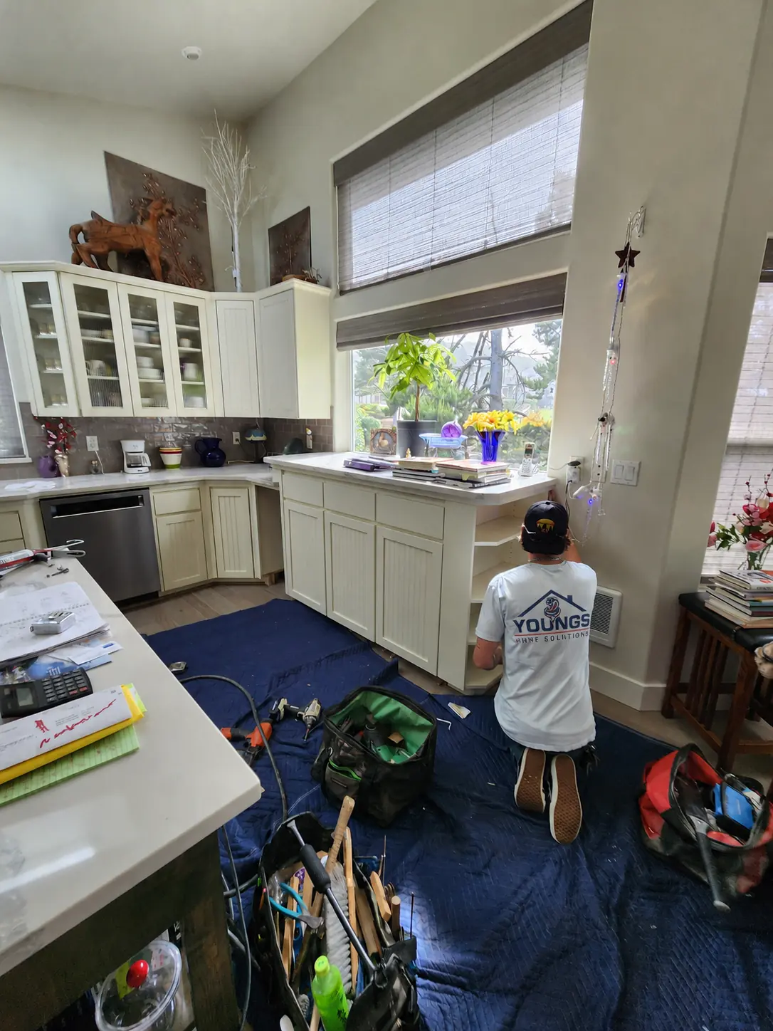 Justin installing and fitting custom kitchen cabinetry